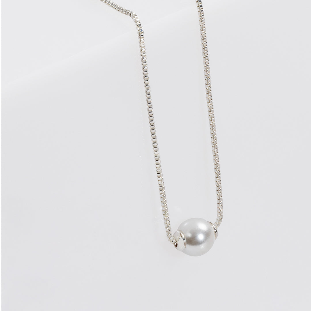 Silver pearl charm necklace