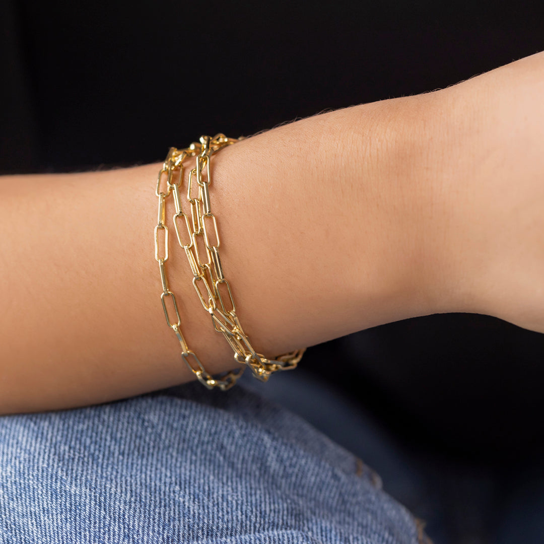 Gold paperclip chain necklace wrapped as bracelet